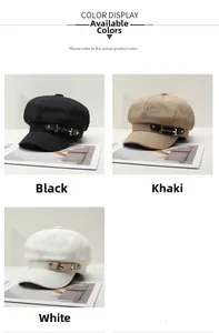 Detail of British style newsboy caps in black, khaki, and white with metal buckles