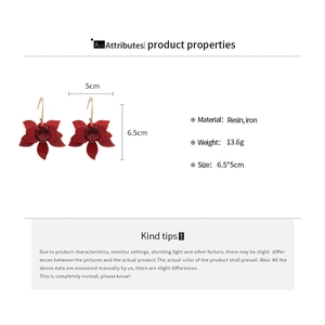 Detail showing red resin flower earrings dimensions 6.5x5cm with weight specifications