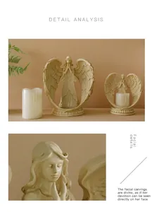 Detailed view of angel figurines showing praying hands and fine wing carvings in ivory