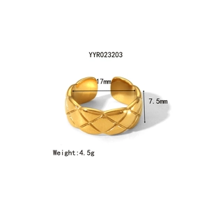 Macro view showing 7.5mm width and 17mm diameter of gold hammered stainless steel ring