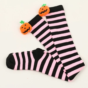 Detail of Halloween over-knee socks with black pink stripes and orange pumpkin accents