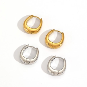 Macro view of teardrop 18k gold plated stainless steel hoop earrings with hinged closure