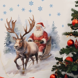 Christmas wall stickers with Santa and reindeer displayed on a wall near a lighted tree