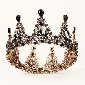 Close-up of Baroque crown featuring black teardrop crystals and gold metal base detail