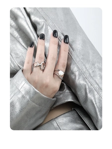 Detail of silver irregular double-layer hollow rings with baroque pearl on hand