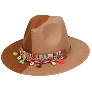 Detailed close-up of felt fedora hat featuring woven band with shells and colorful tassels
