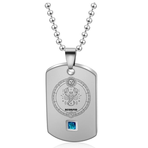 Detail of Scorpio zodiac pendant with laser-engraved scorpion and a blue square gemstone