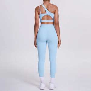 Light blue one-shoulder yoga set with asymmetric sports bra and high-waist leggings