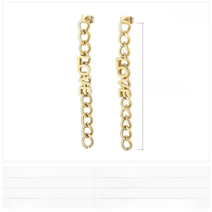 Detail of gold LOVE letter earrings with long metal chain tassels in stainless steel