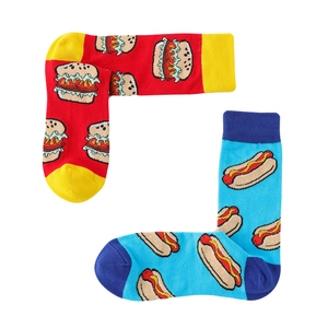 Detail of creative cotton crew socks featuring colorful burger and hot dog food patterns
