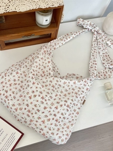 Vintage floral canvas shoulder bag for women with large capacity on white table