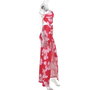 Detail of red floral two-piece set featuring a side high slit maxi skirt on a mannequin