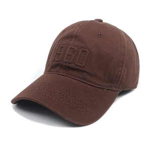 Detailed close-up of 1960 3D embroidery on a coffee brown cotton twill baseball cap