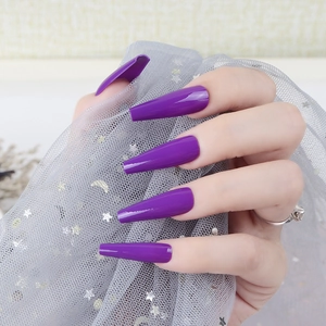 Detailed view of long coffin-shaped deep purple glossy press-on nails for women