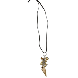 Bohemian Mercato ivory pendant necklace with golden accents and black leather cord