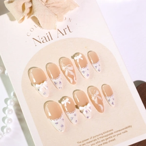 Sweet almond nails with French lace, purple floral art, and 3D bows with pearls