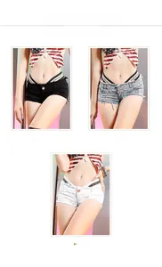 Dettaglio shorts in denim a vita bassa con fascia elastica logata e bordi a frange