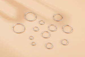 Polished 304 stainless steel hoop earrings shown in various sizes and diameters