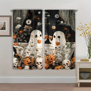 Detail view of black Halloween curtains with white ghosts, orange pumpkins and skulls