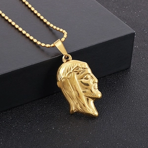 Close-up of 18K gold-plated stainless steel Jesus pendant with beaded chain necklace