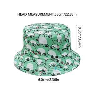 Size chart showing dimensions for a light green bucket hat with frog cartoon patterns