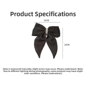 Detail view of black satin bow hair clip with pearl decor, measuring 16cm by 19cm