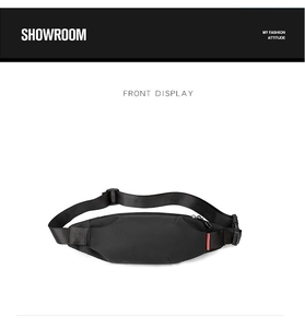 Close-up of black nylon chest bag featuring durable plastic buckle and red accent tag