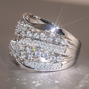 Macro shot of a layered silver rings with sparkling pavé-set round cubic zirconia stones