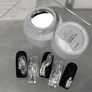 Macro shot of silver metallic gel polish with high-gloss mirror effect on nail tips