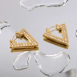 18k gold plated geometric triangle stud earrings with inlaid zircon on reflective surface