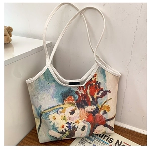 Detail of oil painting canvas tote bag leaning on a white wall with abstract floral print