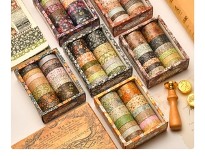 Detailed close-up of 12-roll floral washi tape set in vintage themed gift packaging