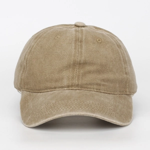 Detail view of a plain washed cotton baseball cap in khaki, front view texture.