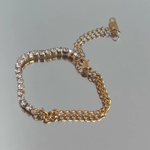 Detail of 18k gold plated Cuban link and tennis chain patchwork bracelet with zircon