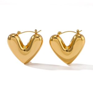 Polished hollow heart hoop earrings in 18K gold plated stainless steel on white back