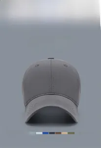Detailed close-up of a grey cotton baseball cap showing 6-panel design and texture