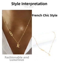 Detail view of a gold infinity necklace featuring a personalized initial pendant and beads