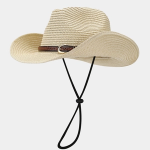 Detail of beige straw hat with woven leather buckle strap and adjustable wind rope strap