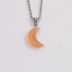 Detailed shot of silver twist rope chain with orange crescent moon stone pendant necklace