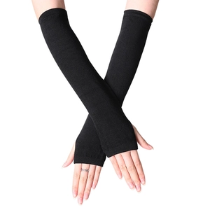 Long black knitted arm warmers with thumb holes in a cross-arm pose on white background