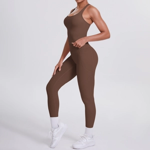 Detail view of brown high-waisted yoga leggings with side pockets and sports bra set