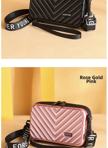 Mini suitcase crossbody bags in black and rose gold with striped hard shell texture