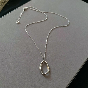 Detail of silver irregular pendant with lobster clasp and adjustable extension chain