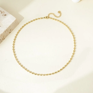 Detail of gold oval bead necklace with adjustable lobster clasp and metallic luster