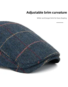 Detail of herringbone flat cap showing the flexible wide brim for face contouring