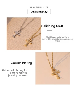 Close-up of zircon-encrusted Ankh pendant in gold and silver finishes on a fine chain