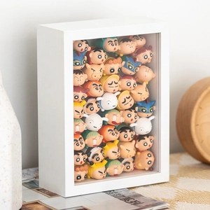 White deep shadow box frame filled with stacked Crayon Shin-chan anime character figures