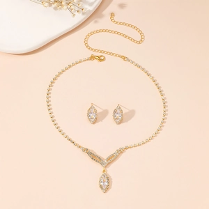 Close-up of gold-plated alloy bridal set showing detailed marquise-cut zircon pendant and earrings