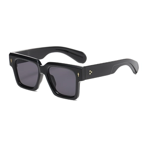 Retro square chunky black sunglasses with golden metal studs and dark grey lenses