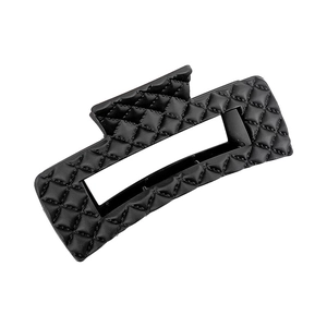 Elegant large black hair claw clip with classic quilted pattern and leather-like texture